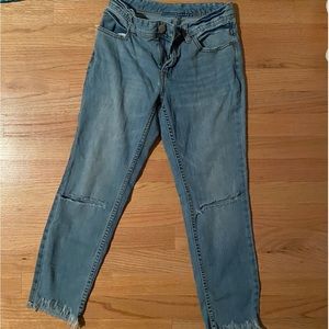 Cropped frayed free people jeans.